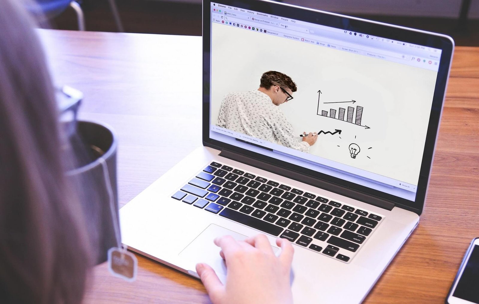 Labtop with man and graphs and charts on the screen