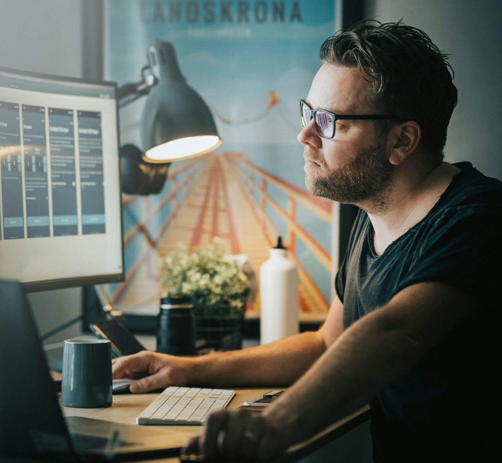 Casual middle aged man at a desk working